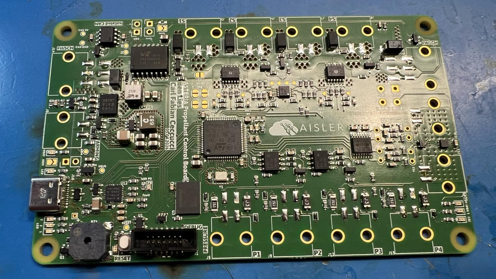 The assembled Propellant Control Board, a four-layer green PCB carrying an STM32G4, four solenoid channels, pressure and thermocouple inputs and an isolated CAN section