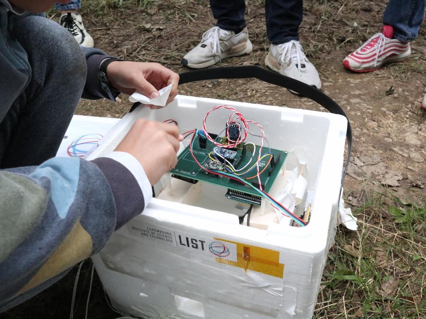 The electronics being fitted into the insulated payload box
